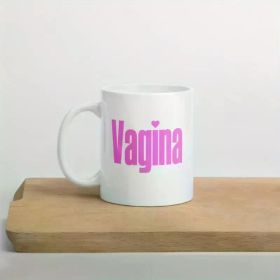 A pink mug with a design representing LGBTQ pride, female empowerment, and feminism.